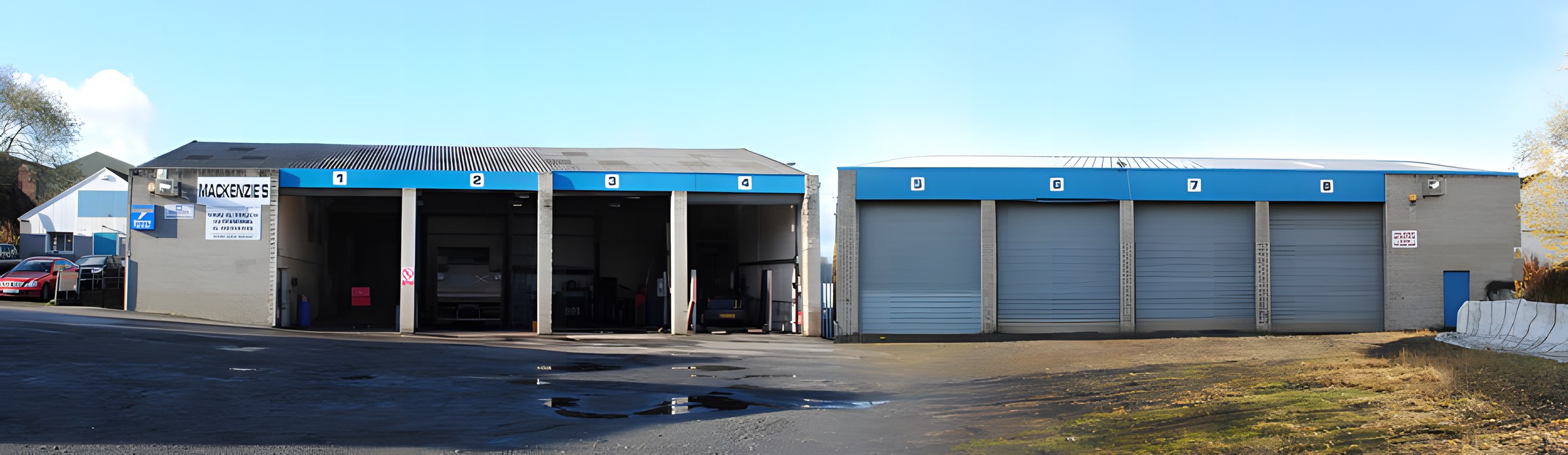 The Mackenzies workshop on Somervell Street with its eight numbered vehicle bays