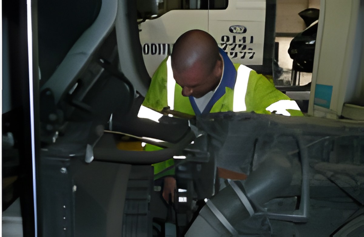 Mackenzies technician working on a truck chassis